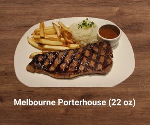Melbourne Porterhouse steak – thick-cut, juicy T-bone combining filet and strip steak grilled to perfection – bold Outback Steakhouse entrée