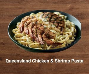 Queensland Chicken and Shrimp Pasta tossed in creamy Alfredo sauce with sautéed mushrooms – hearty Outback pasta entrée