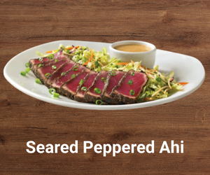 Seared peppered ahi tuna served rare with Asian slaw and creamy ginger-soy sauce – premium Outback Steakhouse appetizer